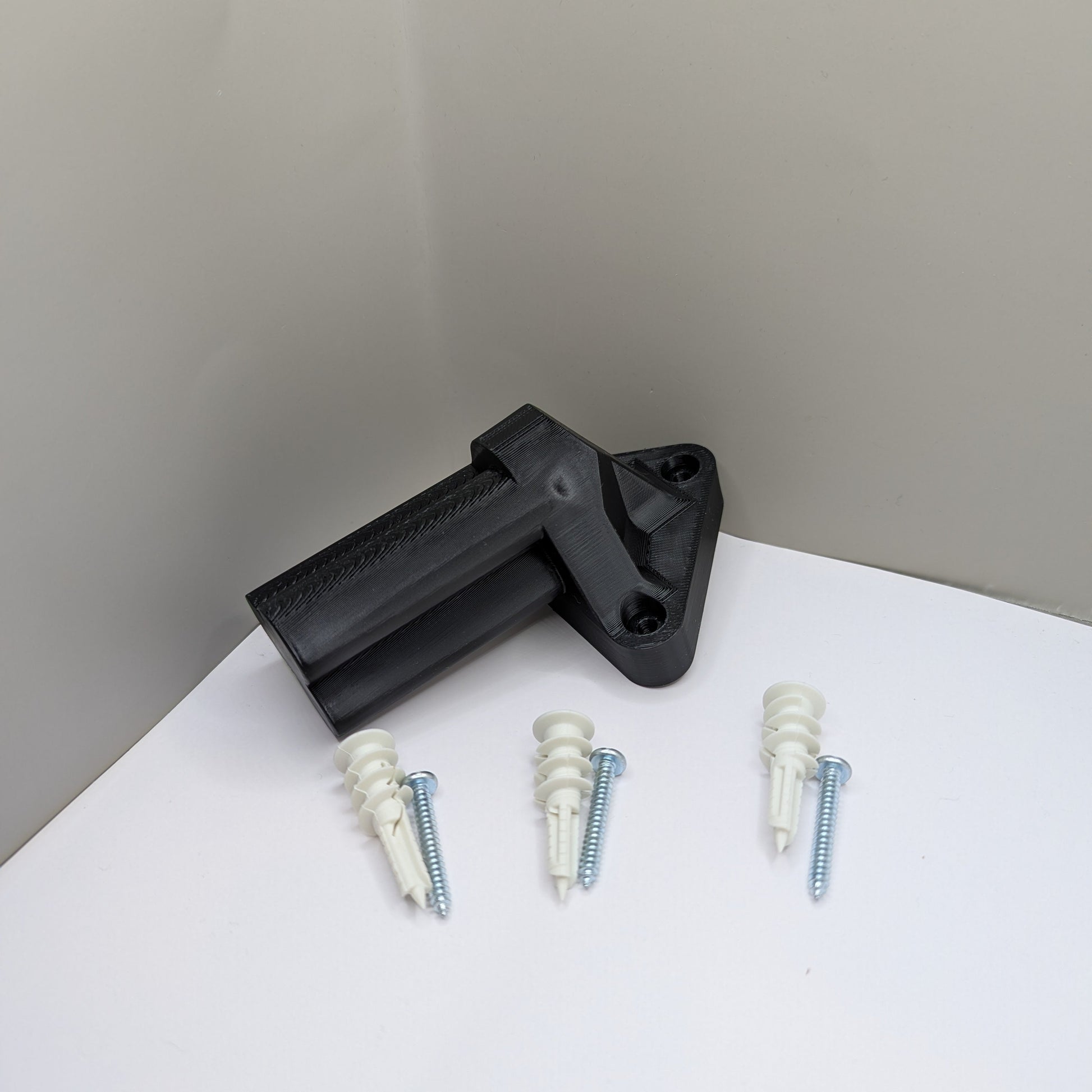 Three drywall anchors included with mounting hardware for m12 tool