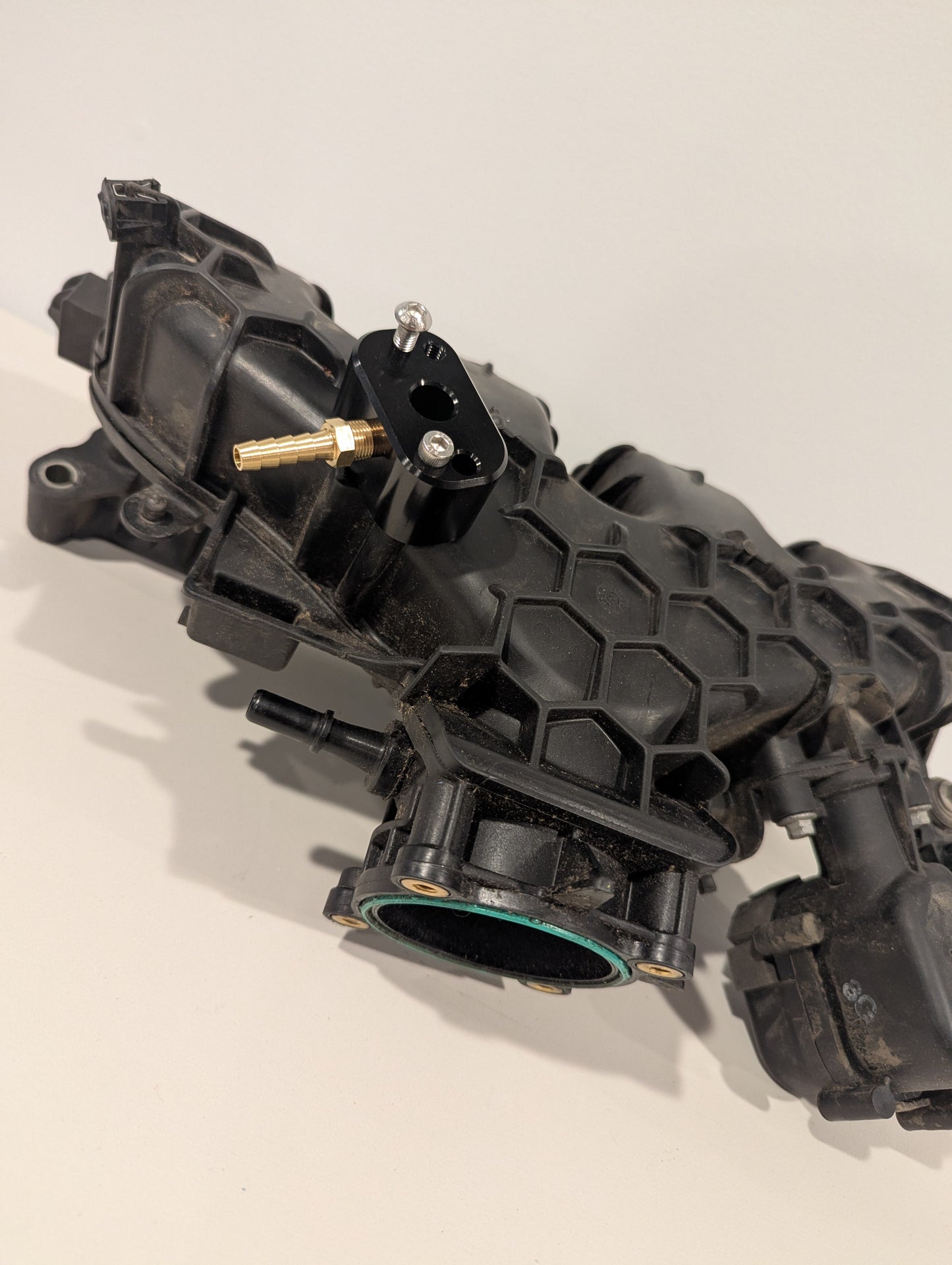 Ecoboost map tap mounted on a Ford Focus intake manifold
